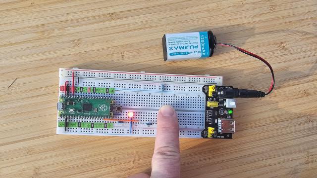 Button controlling external LED